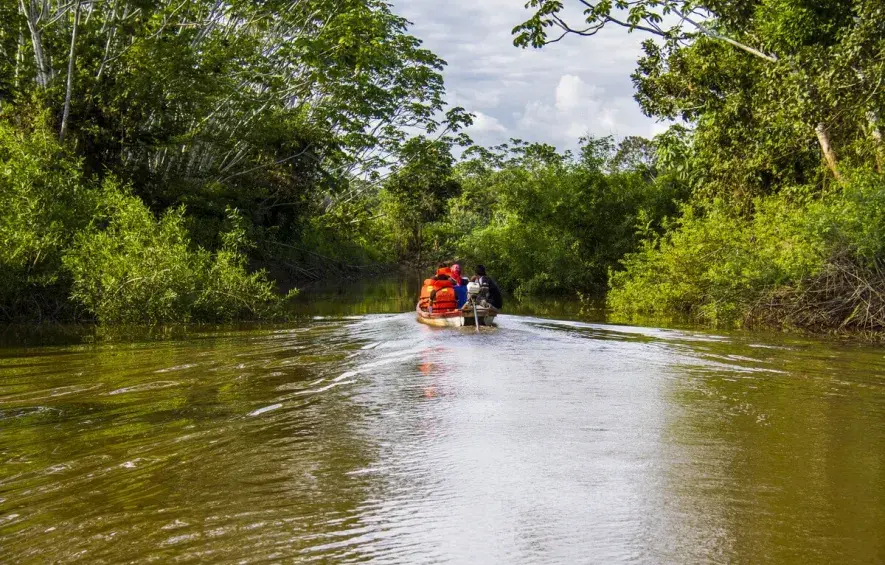 Family in a Boat— Amazon Jungle | Peruvian Sunrise Family in a Boat— Amazon Jungle | Peruvian Sunrise